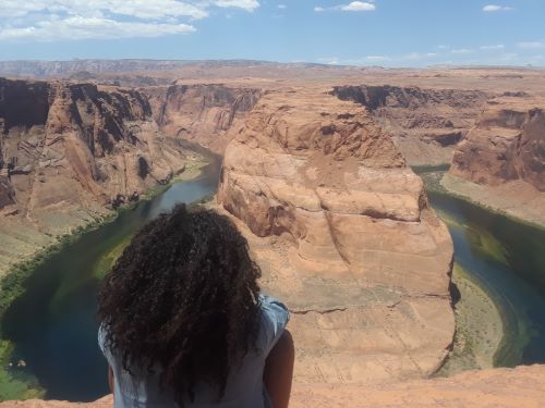 Horseshoe bend solo woman travel black hair